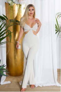 Tuta schiena scoperta con ritagli ai fianchi. Colore beige. Tuta schiena scoperta con ritagli ai fianchi. Colore beige.
