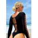 Body nero a maniche lunghe con inserti a rete. Body nero a maniche lunghe con inserti a rete.